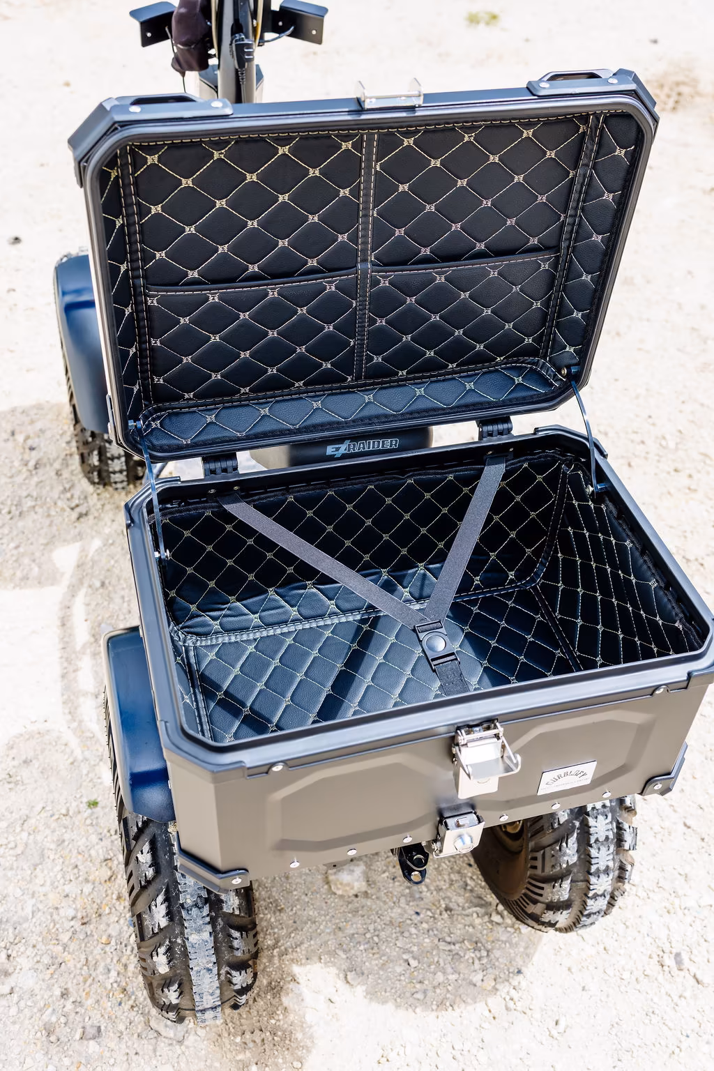 Open rear storage box mounted on an EZ Raider