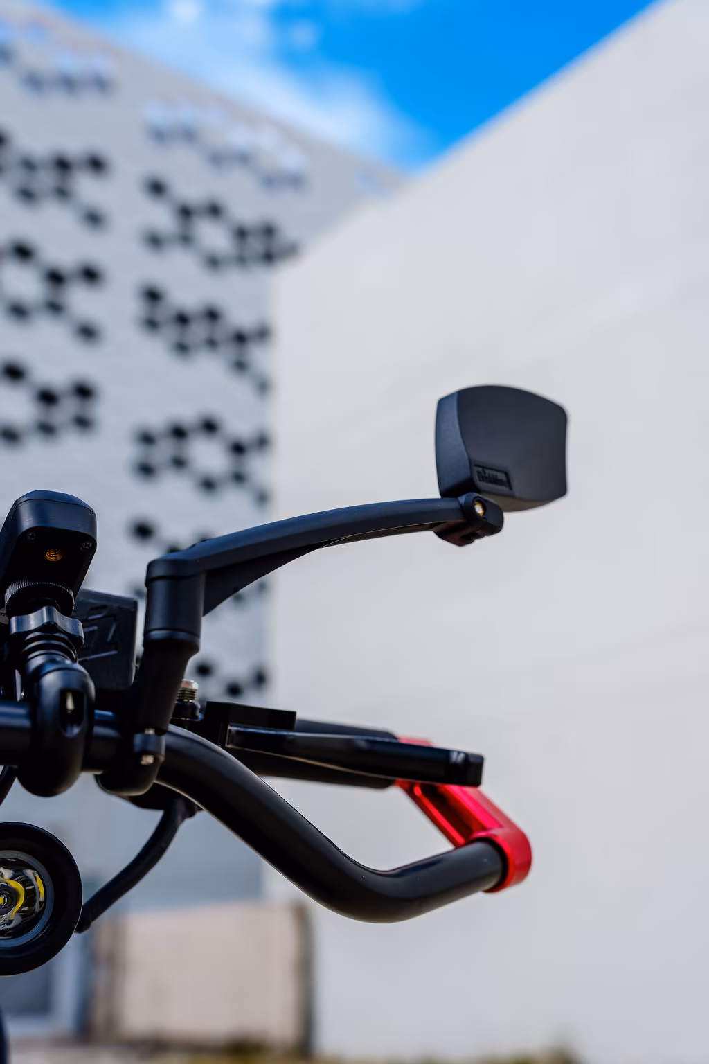 Close-up of an EZ Raider handlebar mirror and brake lever